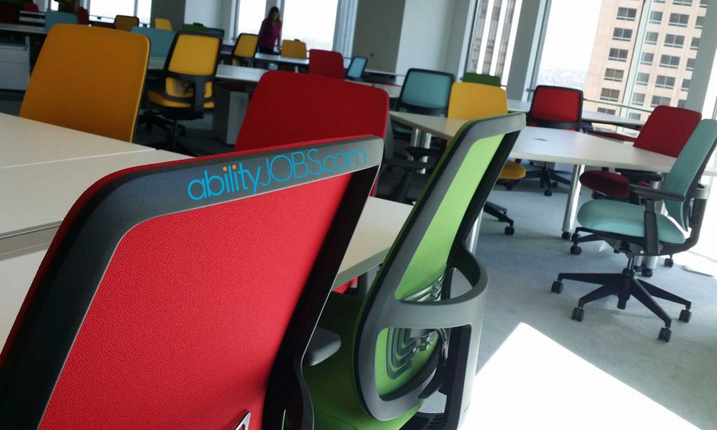colorful office chairs with abilityjobs logo