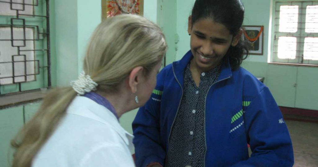 Stephanie Ortoleva talks with young blind student about her career options and strategies for independence in India